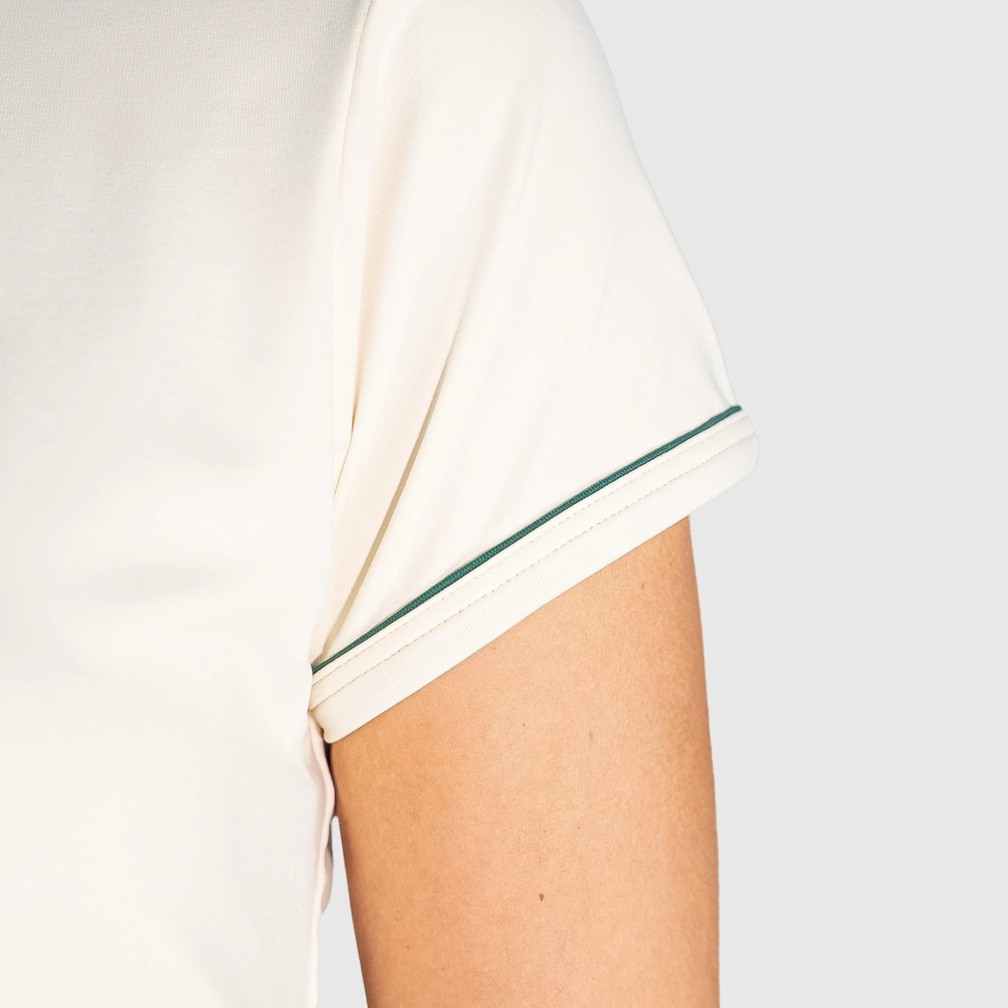 New Regular Padel shirt with green trim on a plain background