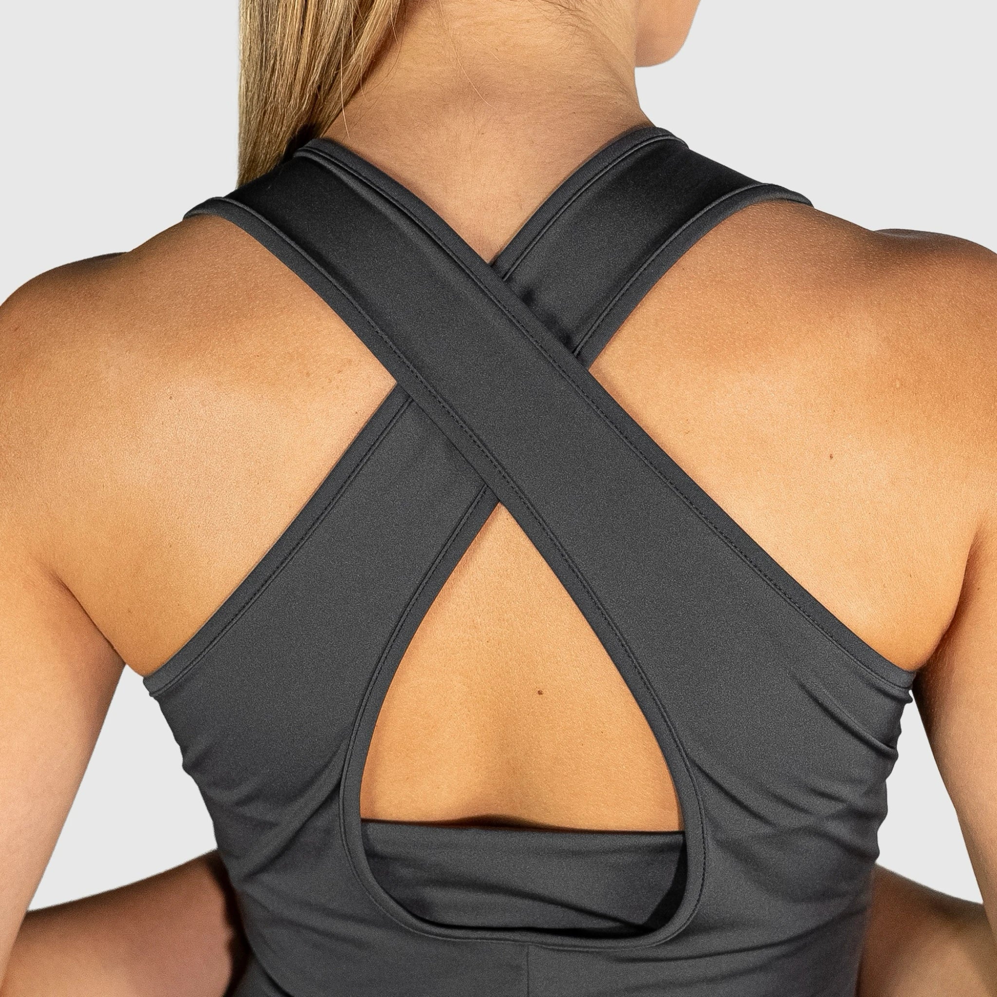 QUAD Twist Padel Dress with criss-cross back design on a neutral background