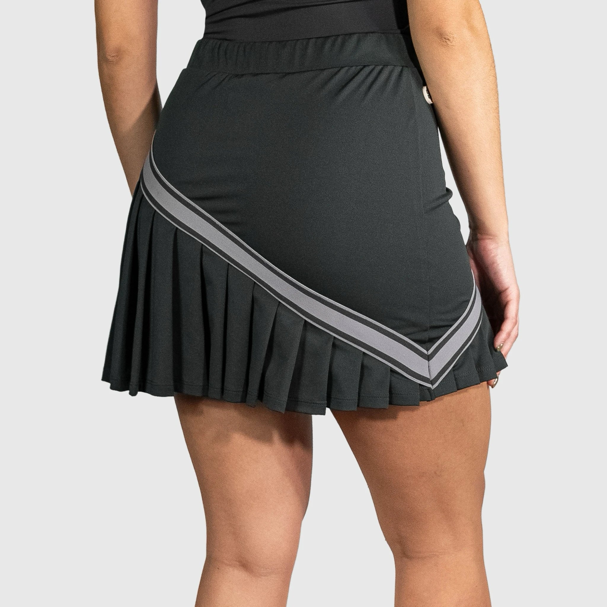 QUAD Halo Padel Skirt with gray stripes on a plain background