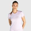 Woman wearing a New Regular Padel shirt  with a brand logo on a white background